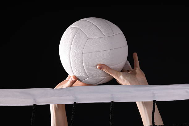 Volleyball spike hand block over the net. High quality photo