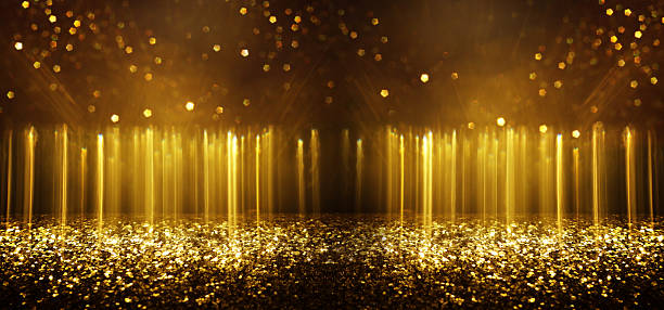 istock abstract glitter gold and black lights background. de-focused 2219464934