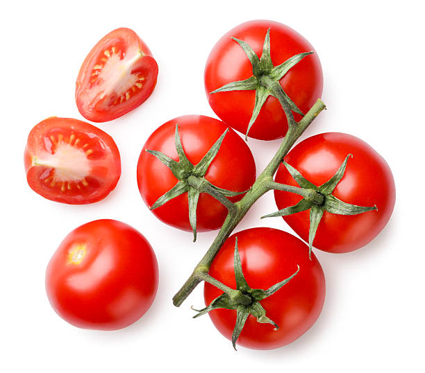 istock Ripe cherry tomatoes on a branch and pieces on a white background. Top view 2219469653