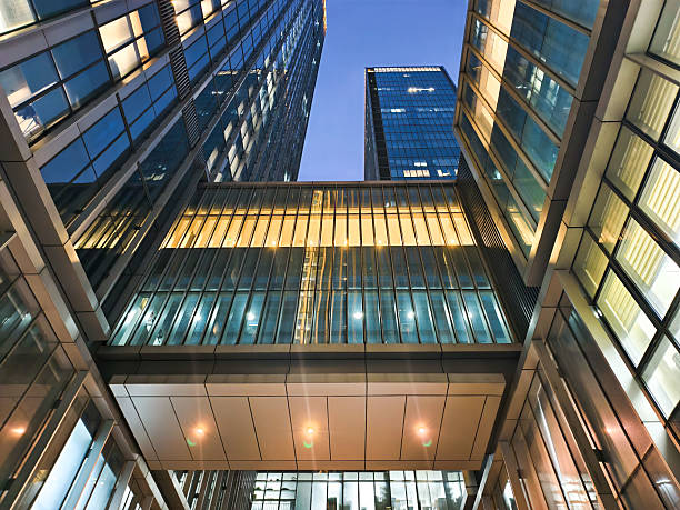 istock uplook modern office building at night 2219470019