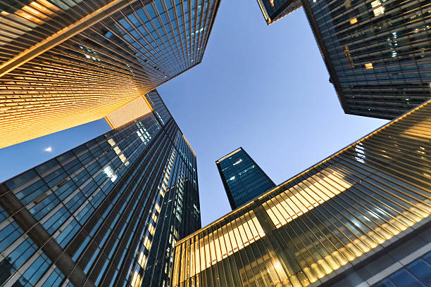 istock uplook modern office building at night 2219470050