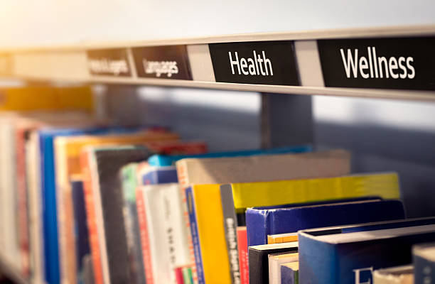 Health and wellness self help books on diet and exercise with physical, mental, and social wellbeing information. Reading library or bookstore scene depicting personal development, lifestyle, fitness and quality of life works by authors.