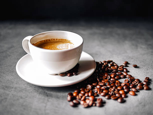 istock Coffee cup and coffee beans on gray background,  Espresso coffee cup aromatic 2219472874