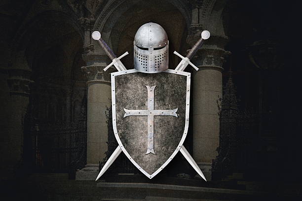 istock knight's helmet shield and two crossed swords on dark background 2219473022