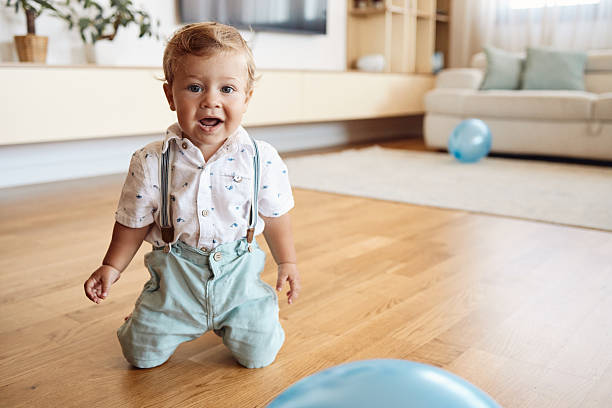 Beautiful, happy baby boy indoors.