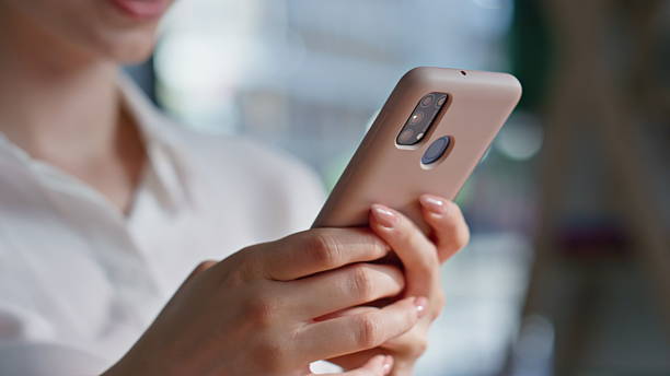 istock Lady hands texting mobile phone at workspace closeup. Smiling woman messaging 2219473589