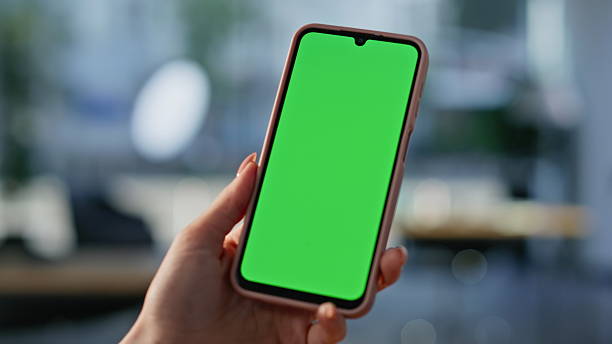 istock Freelancer watching mockup cellphone sitting workplace closeup. Unknown woman 2219474796