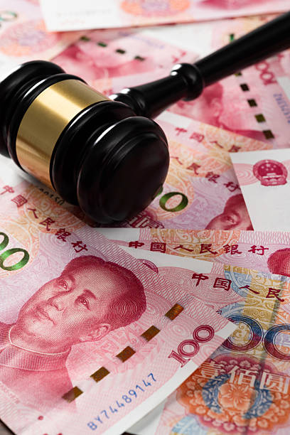 istock Gavel on stack of Chinese currency 2219475352