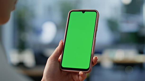 istock Hands scrolling chromakey mobile phone choosing online purchases at home closeup 2219475592