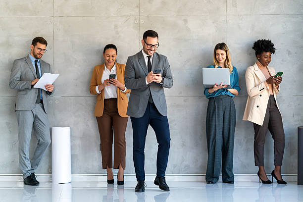 istock Happy businesspeople laughing while collaborating on a new project in an office. 2219475936