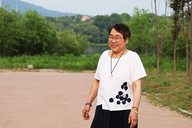 An elderly Asian woman in the park