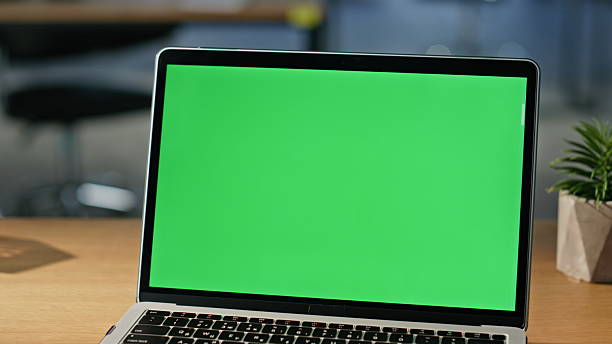 istock Freelancer browsing website chroma key laptop on wooden office table closeup. 2219476872
