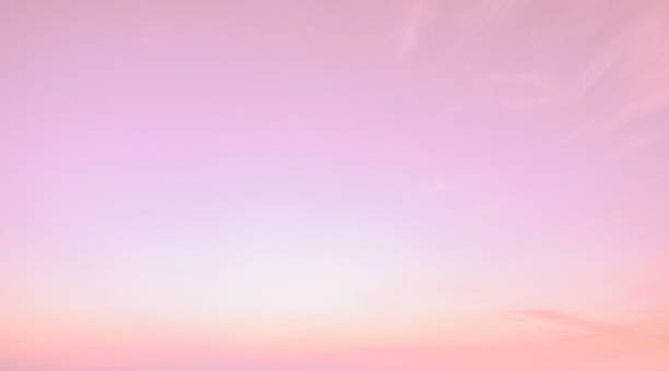 istock Beautiful pink sky texture background during sunset creating soft pastel gradient perfect for romantic design projects and feminine marketing materials. Romantic background for wedding invitations. 2219478457
