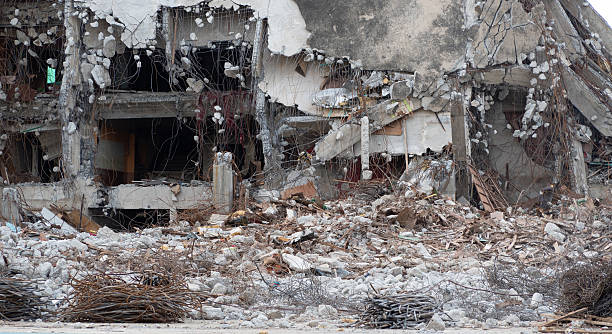 istock Demolished building with construction debris and scrap metal showcasing professional demolition contractor work for urban development and reconstruction projects in commercial real estate industry. 2219478521