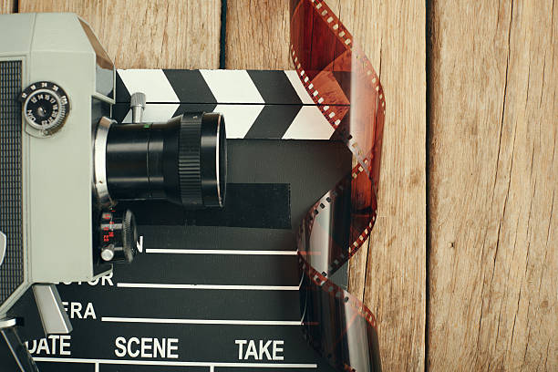 Old movie camera, film clapper board film slate or movie slate