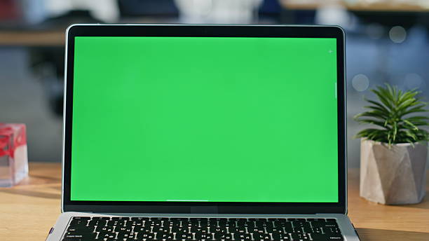 istock Chroma key laptop placed on modern workspace closeup. Green screen computer 2219479190