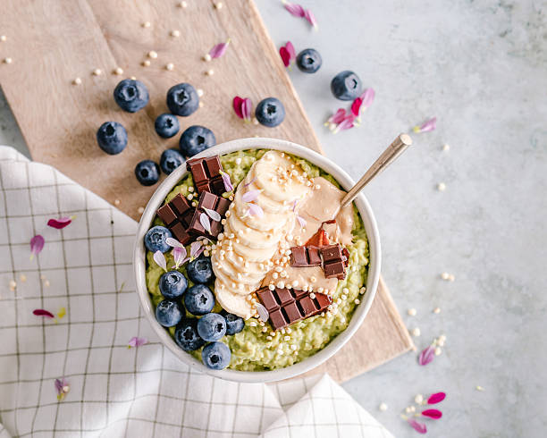 istock Bowl of matcha oatmeal with toppings 2219479384