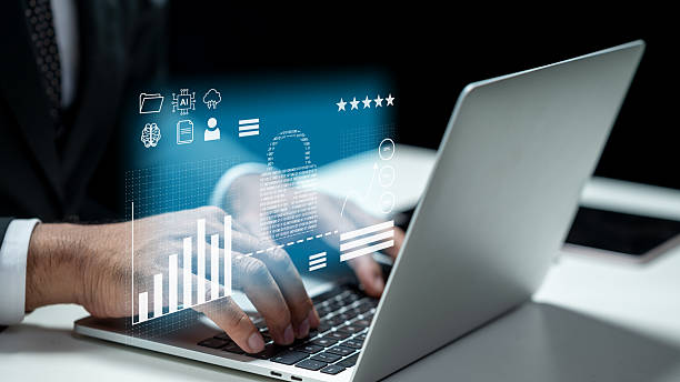 istock Businessman using laptop and showing virtual icon of padlock. Tablet on the table. Technology innovation on a virtual screen. Concept of Cybersecurity, data protection, or digital information privacy 2219480508