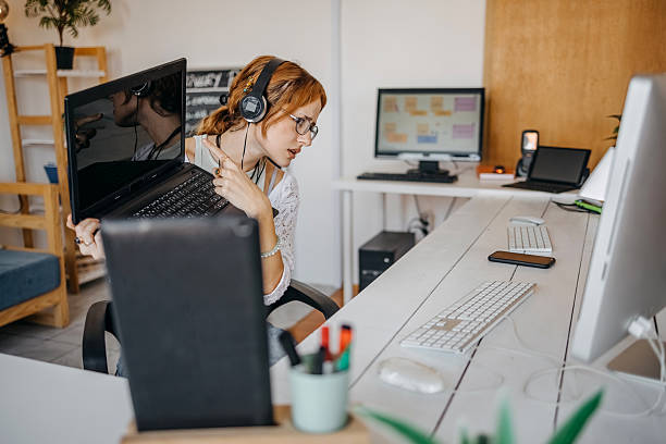 istock Young woman doing computer crime at home and asking for online support from a friend having video call 2219481940