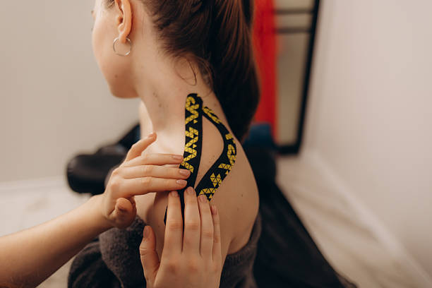 istock Application of Kinesiology Tape for Shoulder Pain Relief and Support 2219482013
