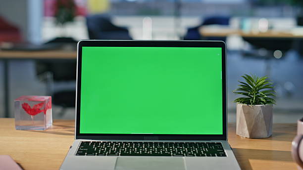 istock Mockup laptop standing office desk closeup. Modern green screen computer online 2219482262