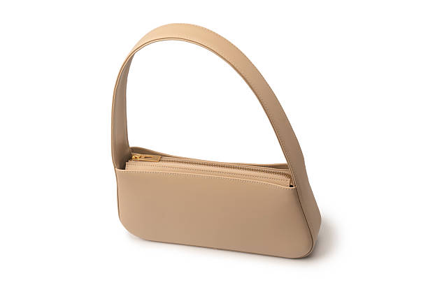 istock Beige women leather bag isolated on white background. 2219482874