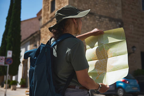 istock Explorer Navigating a Historic Spanish Village with a Map Outdoors 2219486128