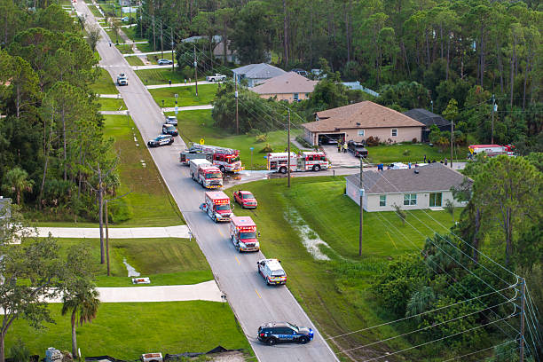istock Emergency service personnel responding to potential fire hazard at Florida home. First responders ready to extinguish fire of burning house 2219488872