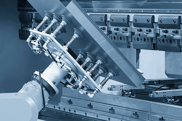 istock High technology bending machine operation with robotic system in the light blue scene. 2219489555