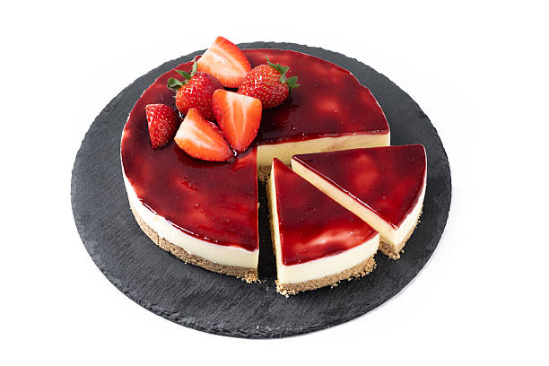istock Cheesecake with strawberries isolated on white background 2219491642