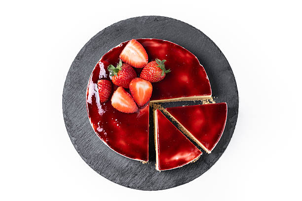 istock Cheesecake with strawberries isolated on white background 2219491725