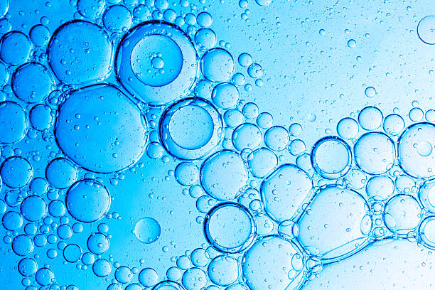 istock Close-up blue science experiment bubble texture,Bubbles in clear liquid, water or gel texture, oil drop, beauty collagen serum, hyaluronic essence skin care smear, aqua purity, abstract background. 2219492333