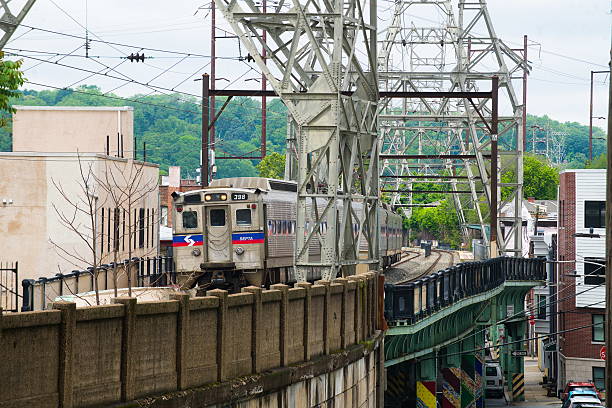 SEPTA train consisting of Silverliner IVs departing from Manayunk on the Norristown Line while transversing the steel truss/viaduct which runs through the Manayunk section of Philadelphia
