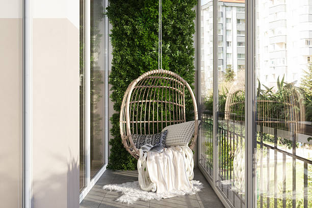 istock Modern Balcony With Wicker Swing And Walled Garden 2219495997