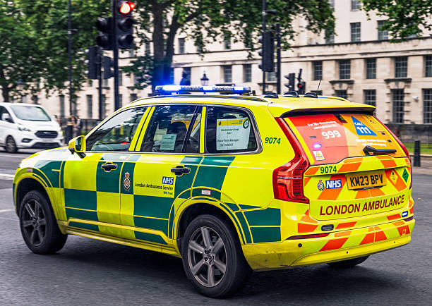 London, UK - A London Ambulance Service vehicle at high speed on the street in Westminster, central London.