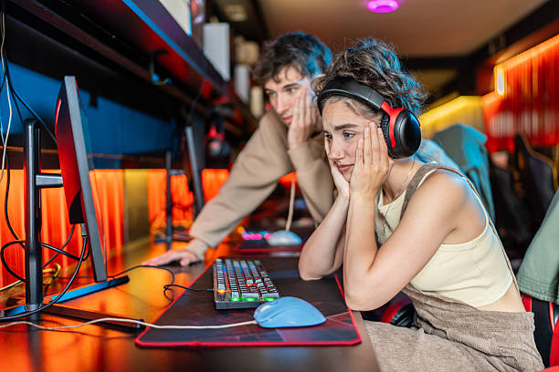 istock Young gamers losing a video game competition in a gaming room 2219498582