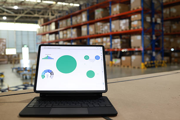 istock Digital tablet or laptop with white screen for job operating in High rack warehouse , logistic management and technology 2219499873