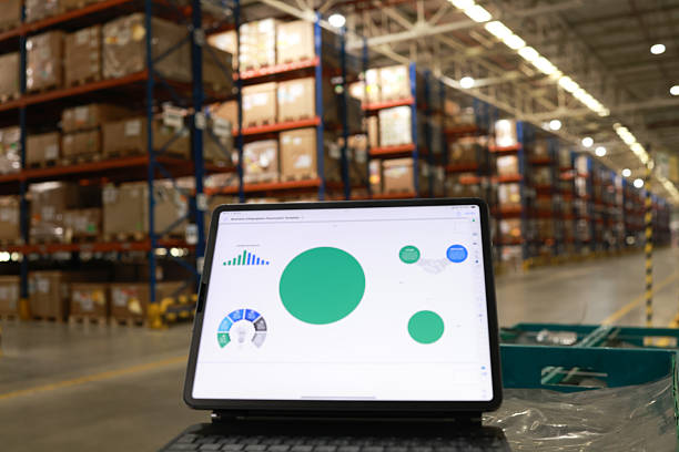 istock Digital tablet or laptop with white screen for job operating in High rack warehouse , logistic management and technology 2219499885