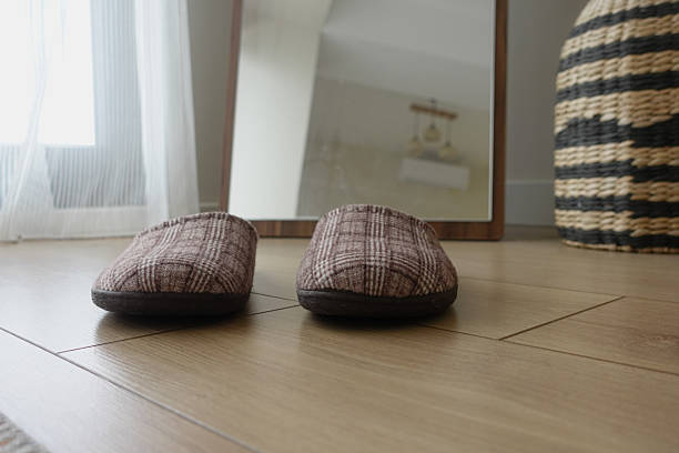 Sandals resting on the floor create a simple yet inviting scene.