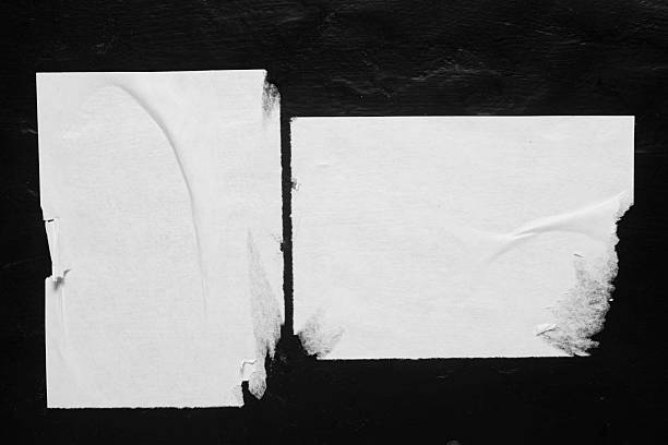 istock Two white posters with folds, close-up. 2219502569