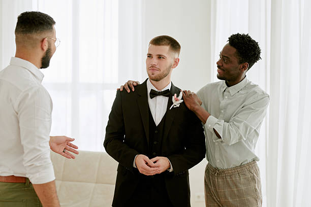 istock Young Caucasian Man Standing with Multiethnic Friends during Wedding Celebration 2219506591