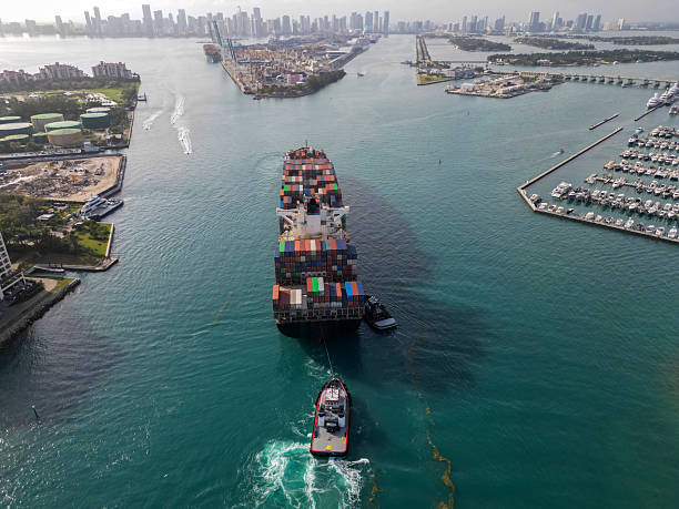 istock Port of Miami. Cargo ship with container, aerial view. Freight container on cargo vessel. Cargo ship vessel leaving port. Container ship. Export and import. Cargo business. Heavy freight logistics 2219507267