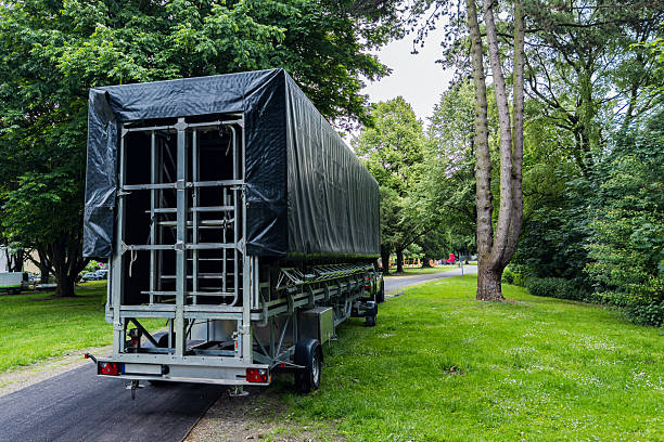 istock Parked trailer covered with tarp in a forested area near a path 2219509069