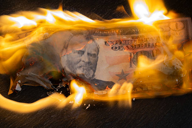 istock Burning US Fifty Dollar 2219509299