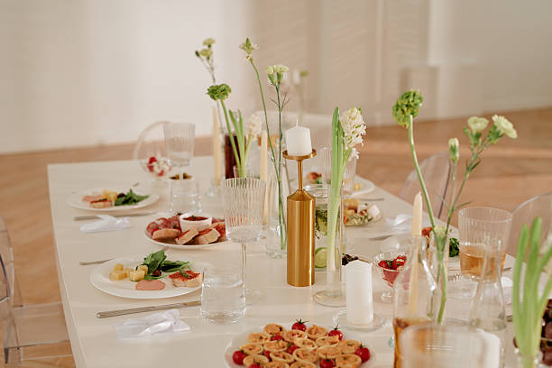 istock Elegant Wedding Reception Table Setting Featuring Flowers and Appetizers 2219512571