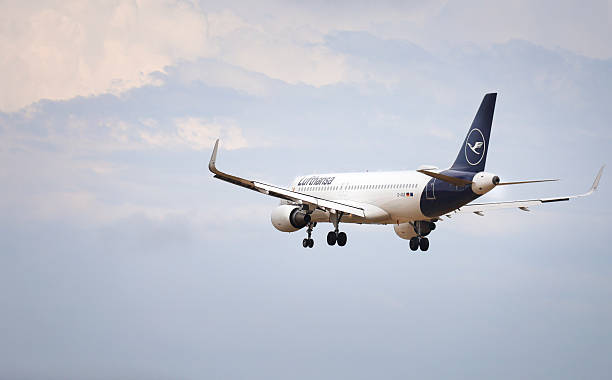 Alicante, Spain- January 28, 2025:Plane of Lufthansa company approaching airport with cloudy sky in Alicante