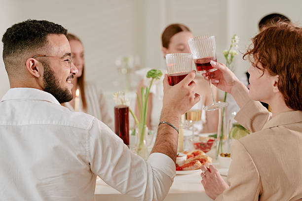 istock Young Multiethnic Adults Celebrating Wedding Toasting Glasses Together 2219512940