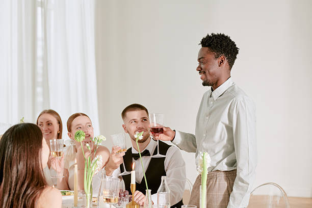 istock Young Multiethnic Adults Toasting and Smiling during Wedding Celebration 2219513070
