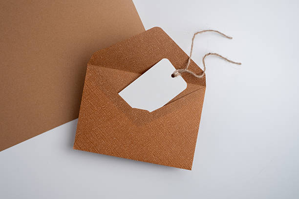 istock Paper envelopes on a light background. New mail, write a message. Send and receive mail. Postal delivery service. Empty envelope, empty space. Communication with people, paperwork. Envelope close-up 2219514547