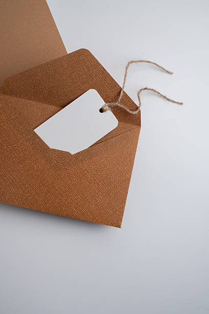 istock Paper envelopes on a light background. New mail, write a message. Send and receive mail. Postal delivery service. Empty envelope, empty space. Communication with people, paperwork. Envelope close-up 2219514578